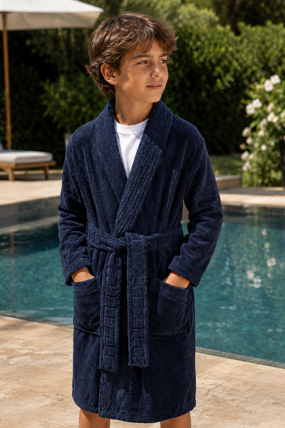 boy wearing Terry Robe near a pool