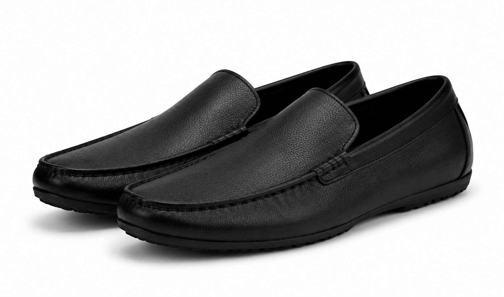 Pair of black leather loafers on a white background